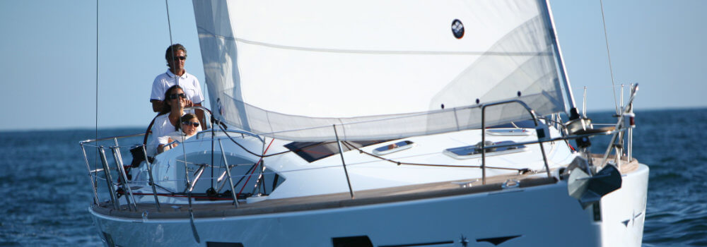 Family enjoying a trip on a sailboat